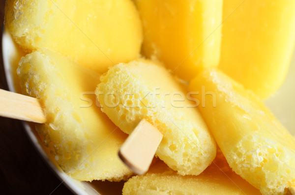 Yellow Pineapple Ice Lollies Grouped in White Bowl Overhead Clos Stock photo © frannyanne