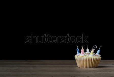 Birthday Cupcake with Candles Blown Out on Black Stock photo © frannyanne