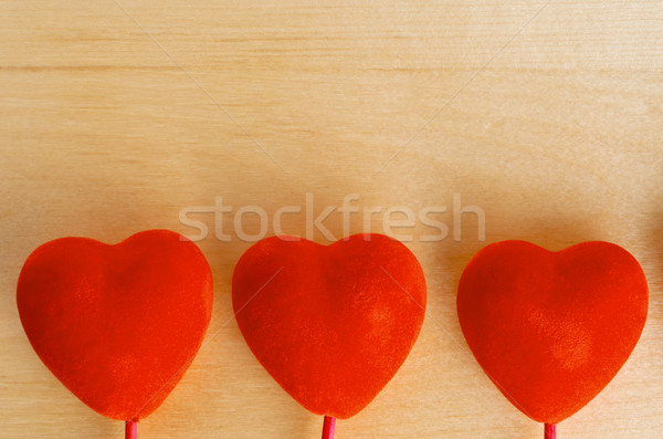 Three Hearts on Wood Background Stock photo © frannyanne