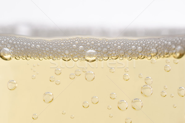 Close Up of Filled Champagne Glass with Rising Bubbles  Stock photo © frannyanne
