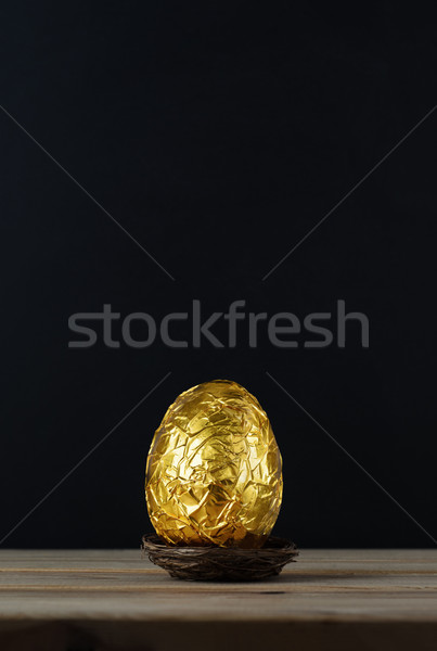 Easter Egg Wrapped in Gold Foil Paper Stock photo © frannyanne