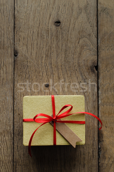 Yellow Gift Box with Red Ribbon and Vintage Style Blank Tag Stock photo © frannyanne