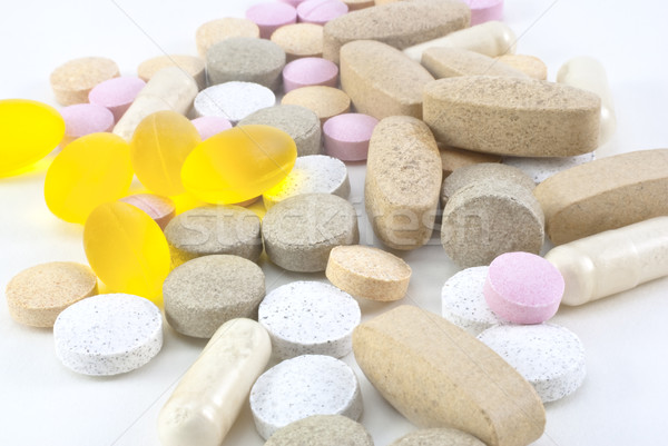 Vitamin kiegészítő tabletták keverék különböző fehér Stock fotó © frannyanne