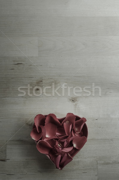 Aerial View of Rose Petals in Heart Shaped Bowl on Wood Stock photo © frannyanne