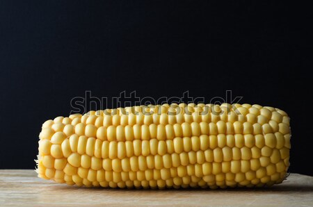 Sweetcorn Cob on Wood with Black Background Stock photo © frannyanne