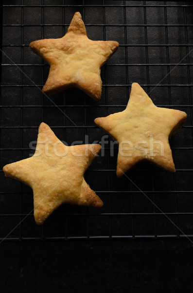 Stock photo: Three Star Shaped Christmas Biscuits on Cooling Rack