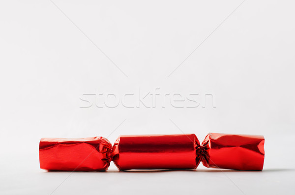 Stock photo: Red Foil Christmas Cracker with Copy Space Above