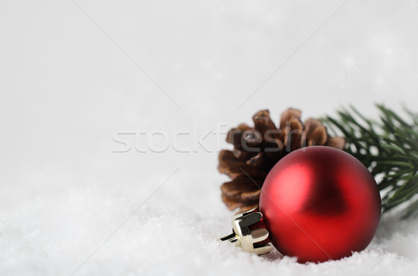 Christmas Border Background with Red Bauble and Foliage on Snow Stock photo © frannyanne