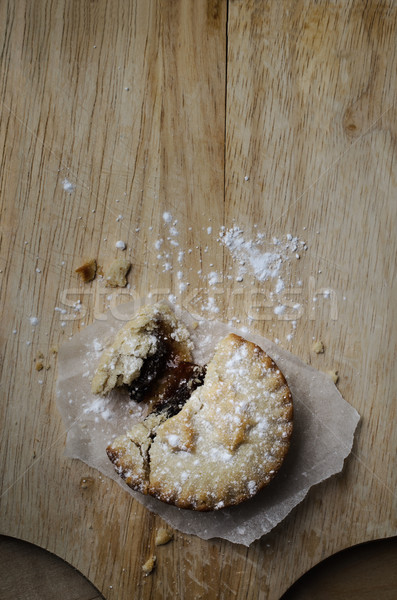 Overhead of  Crumbling Christmas Mince Pie on Old Wooden Board Stock photo © frannyanne