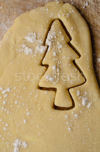 Christmas Tree Shape Cut into Rolled Biscuit Dough Stock photo © frannyanne