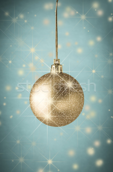 Gold Glitter Christmas Bauble on Turqoise with Stars Stock photo © frannyanne