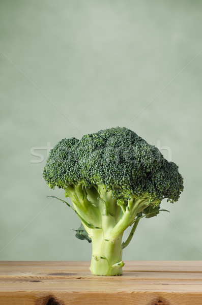Broccoli on Wood with Green Background Stock photo © frannyanne