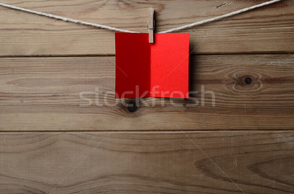 Red Greetings Card Pegged to String on Wood Plank Background Stock photo © frannyanne