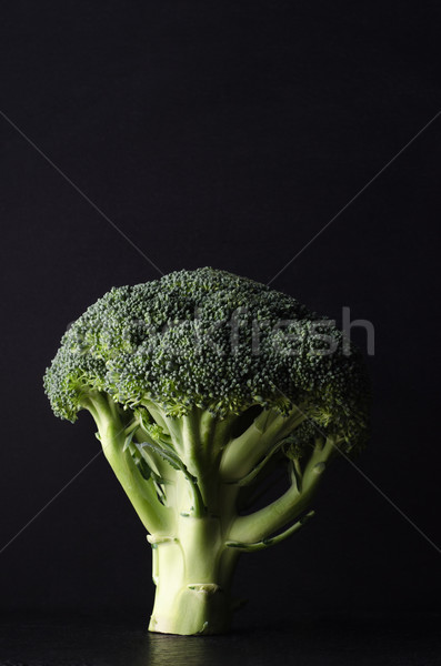 Whole Head of Broccoli Standing Upright on Stem against Black Ba Stock photo © frannyanne