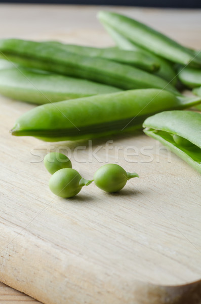 Pea Pods and Peas on Chopping Board Stock photo © frannyanne