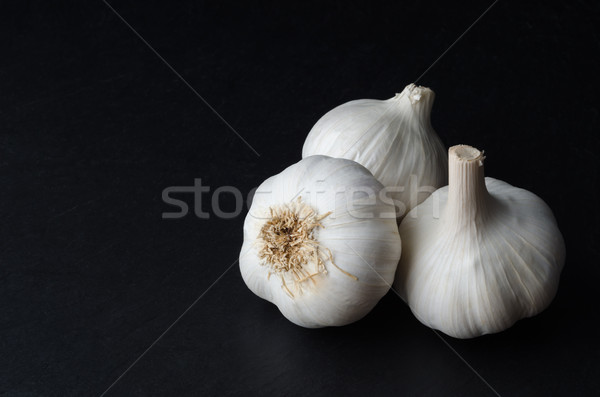 Three Whole Garlic Bulbs on Black Stock photo © frannyanne
