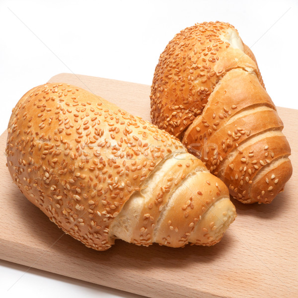 Stock photo: Freshly baked homemade crescent rolls isolated on white