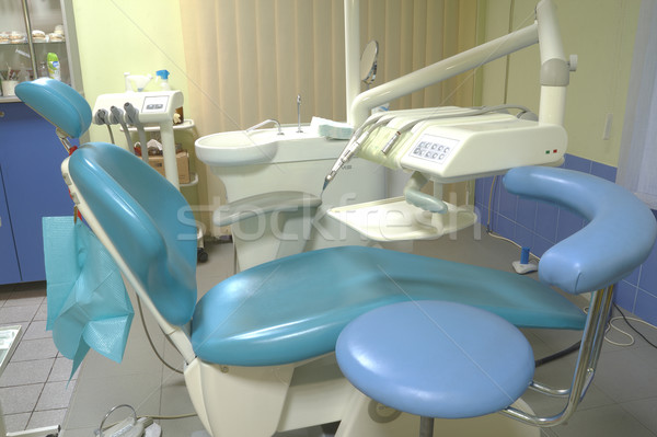 Modern dentist's chair in a medical room. Stock photo © frescomovie