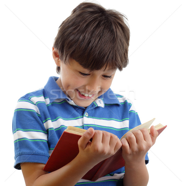 Stock photo: Smiling boy reads book