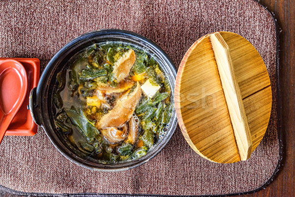 Traditional japanese miso soup in a black bowl Stock photo © frimufilms