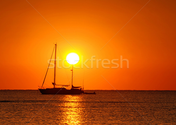 Coucher du soleil bateau voile silhouette or océan [[stock_photo]] © fyletto