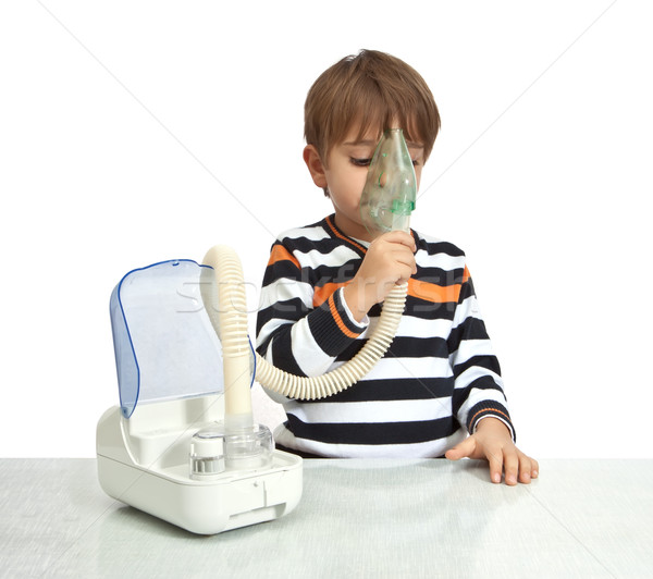 Stock photo: little boy makes inhalation with nebuliser 