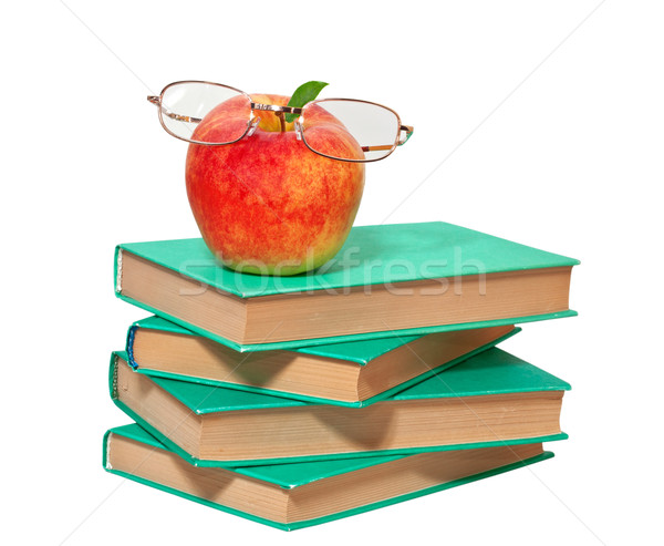 stack of books with an apple and glasses on a white background Stock photo © g215