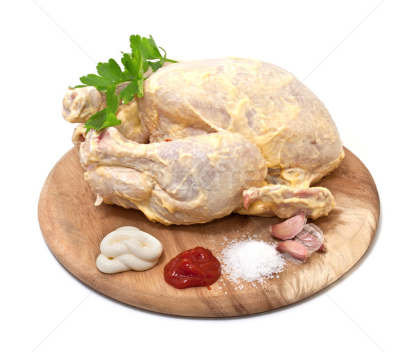 Raw chicken in the marinade on a white background Stock photo © g215