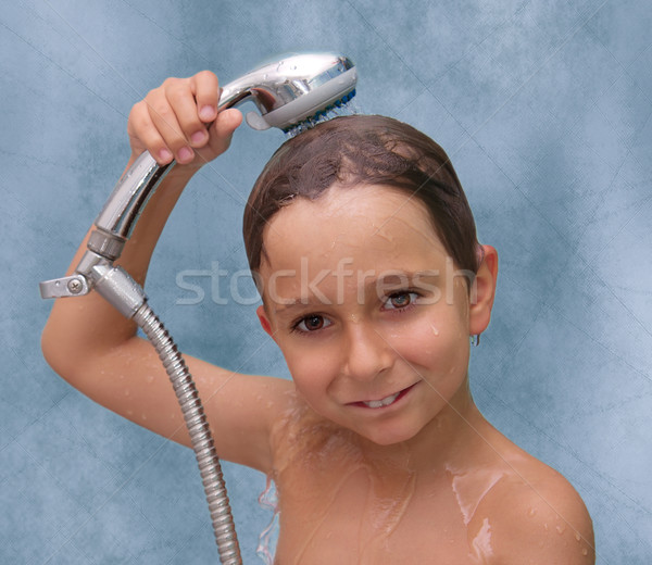 Stock photo: Little boy is bathed in the shower