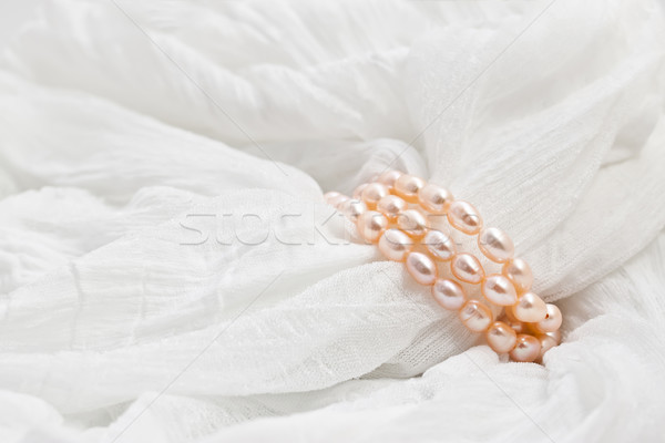 Pink pearls on a white background. Wedding backgrounds. Stock photo © g215