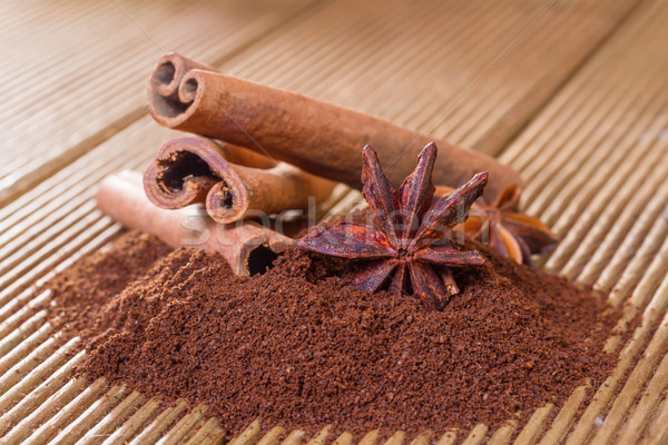 Ground coffee with cinnamon and star anise on a wooden backgroun Stock photo © g215