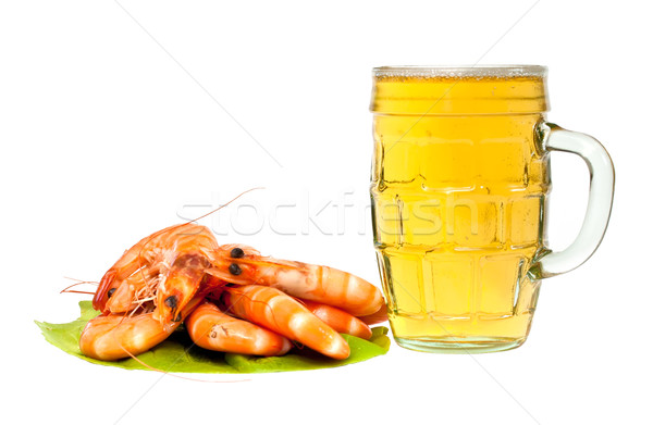 Stock photo: Fresh shrimp on lettuce leaf and a glass of beer isolated on white background