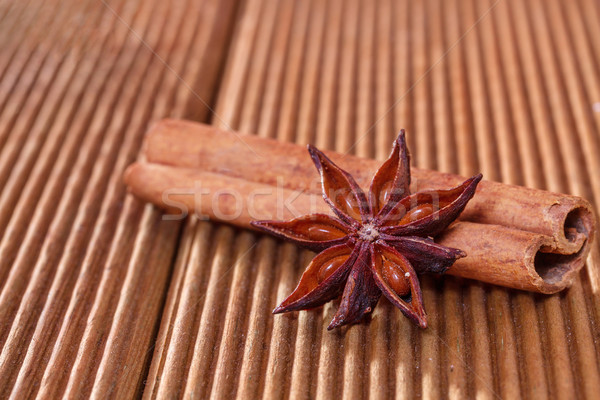 Cinnamon with anise on a wooden background Stock photo © g215