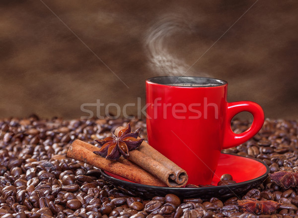 Coffee in a red cup with cinnamon and anise stars. Stock photo © g215