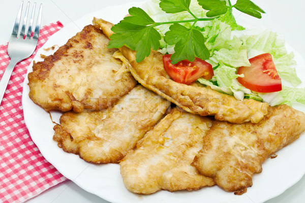 Fried fish fillets with egg and salad. Stock photo © g215