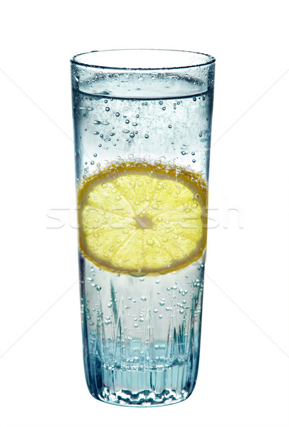 Lemon, in a glass of sparkling water, isolated on white background Stock photo © g215