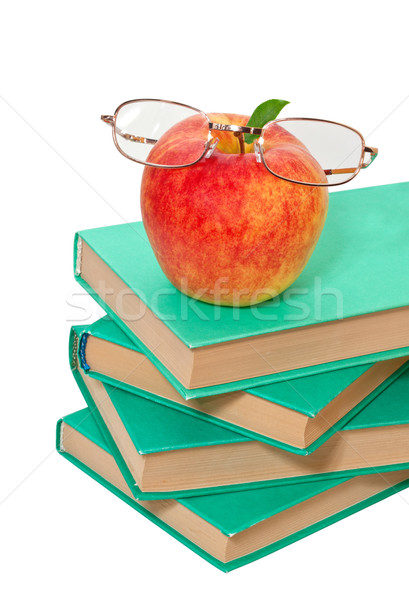 stack of books with an apple and glasses on a white background Stock photo © g215