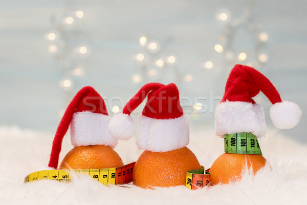 Christmas background with tangerines and measuring meter. Concep Stock photo © g215