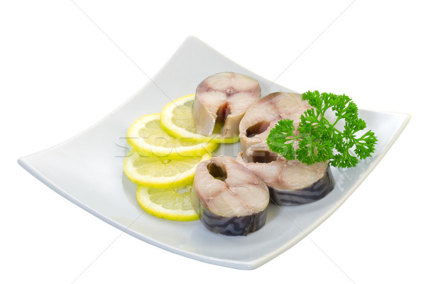 Salted mackerel with lemon on a white background Stock photo © g215