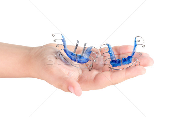Orthodontische behandeling hand geïsoleerd witte glimlach Stockfoto © g215