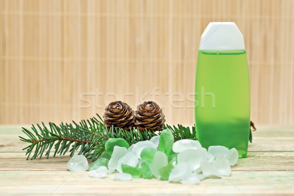 Coniferous extract bath with a sprig of pine needles, pine cones and bath salts. Stock photo © g215