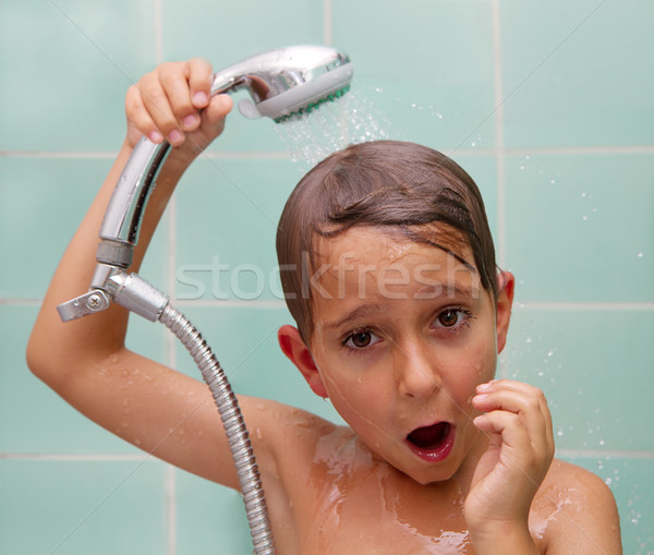 Stock photo: Little boy is bathed in the shower