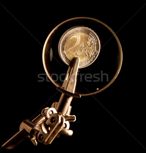 Euro coins under magnifying glass Stock photo © g215