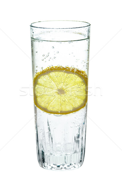 Lemon, in a glass of sparkling water, isolated on white background Stock photo © g215