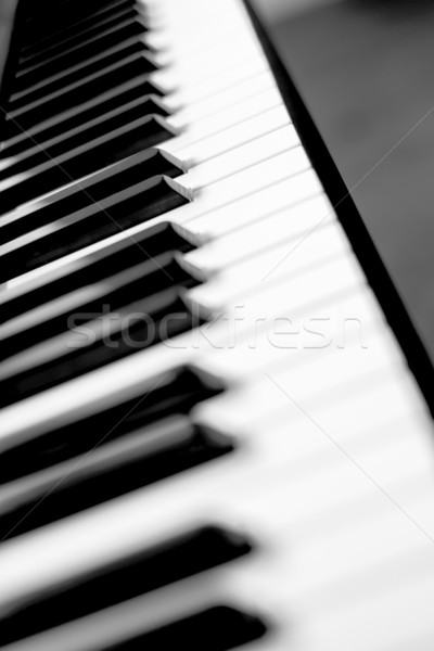 Black piano keyboard. Stock photo © gabor_galovtsik