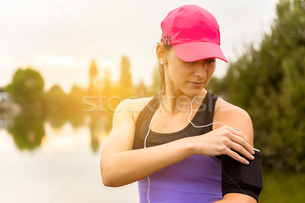 Runner woman hearing music after the run. Stock photo © gabor_galovtsik