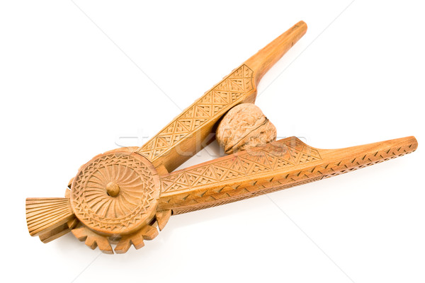 Stock photo: Antique carved wooden nutcracker with walnut