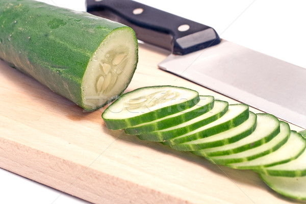 Cucumbers sliced on wooden board  Stock photo © gavran333
