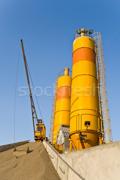 Stock photo: Yellow concrete silos over blue sky