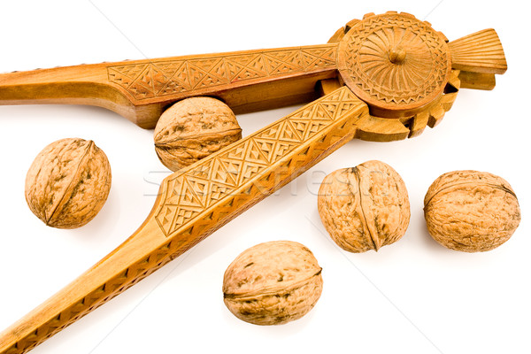 Antique carved wooden nutcracker with walnuts Stock photo © gavran333